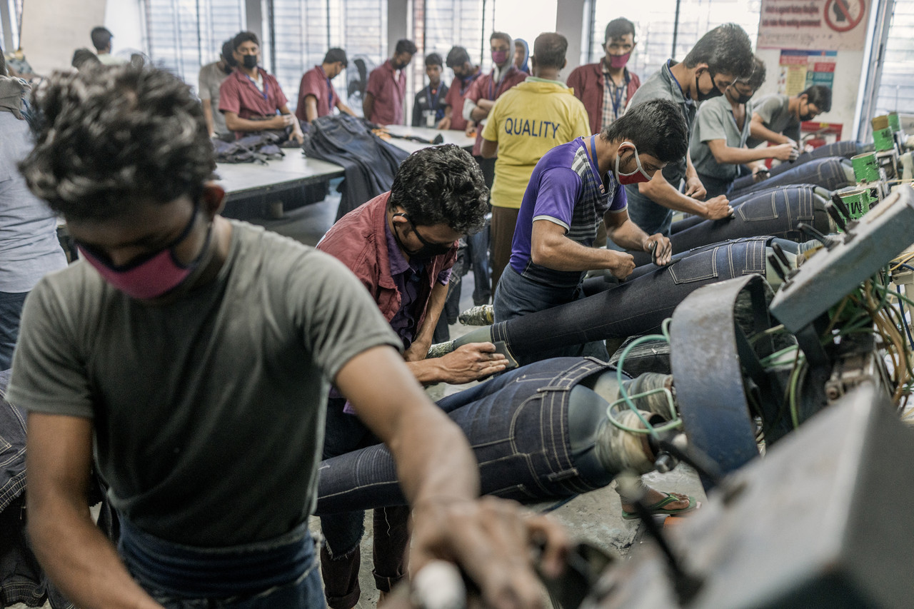 By contrast it takes many workers to distress denim jeans by hand sanding